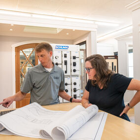 Talbert Building Supply employee reviewing plans with a customer, demonstrating personalized service and Talbert difference