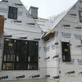 Home under construction featuring Marvin windows and Typar Talbert wrap for weather protection