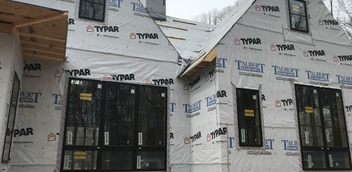 Home under construction featuring Marvin windows and Typar Talbert wrap for weather protection