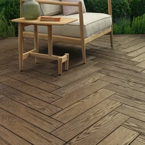 A photo showing a premium deck built with Millboard Enhanced Grain SB Antique Oak Lifestyle Cameo