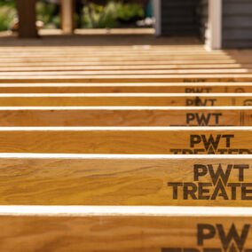 PWT treated joists lined up on a construction project