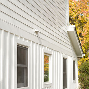 Close-up view of James Hardie siding on a home exterior with vertical and horizontal panels