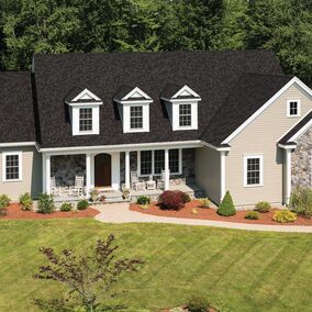 IKO Cambridge architectural shingles on a large suburban home with stone veneer accents