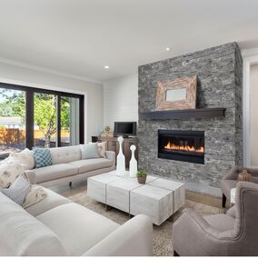 Modern living room featuring Evolve Stone veneer on a fireplace