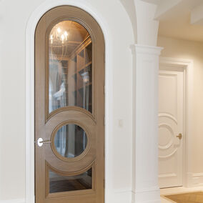 Elegant TruStile glass interior door with arched design, enhancing a classic and sophisticated home interior