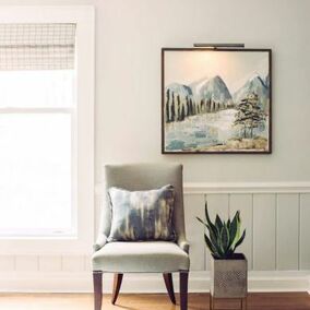 Interior room featuring charles grey mouldings, a chair and decorative art piece hanging on the wall