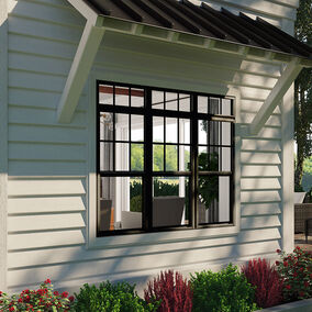 Exterior view of a home featuring Atrium windows with black trim and white siding