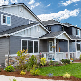 YKK AP vinyl windows and doors on a modern suburban home with a landscaped front yard